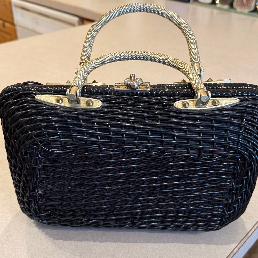 Vintage black wicker box purse with a red lining and gold tone hardware.